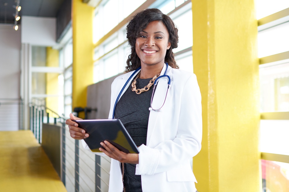 Female doctor holding tablet